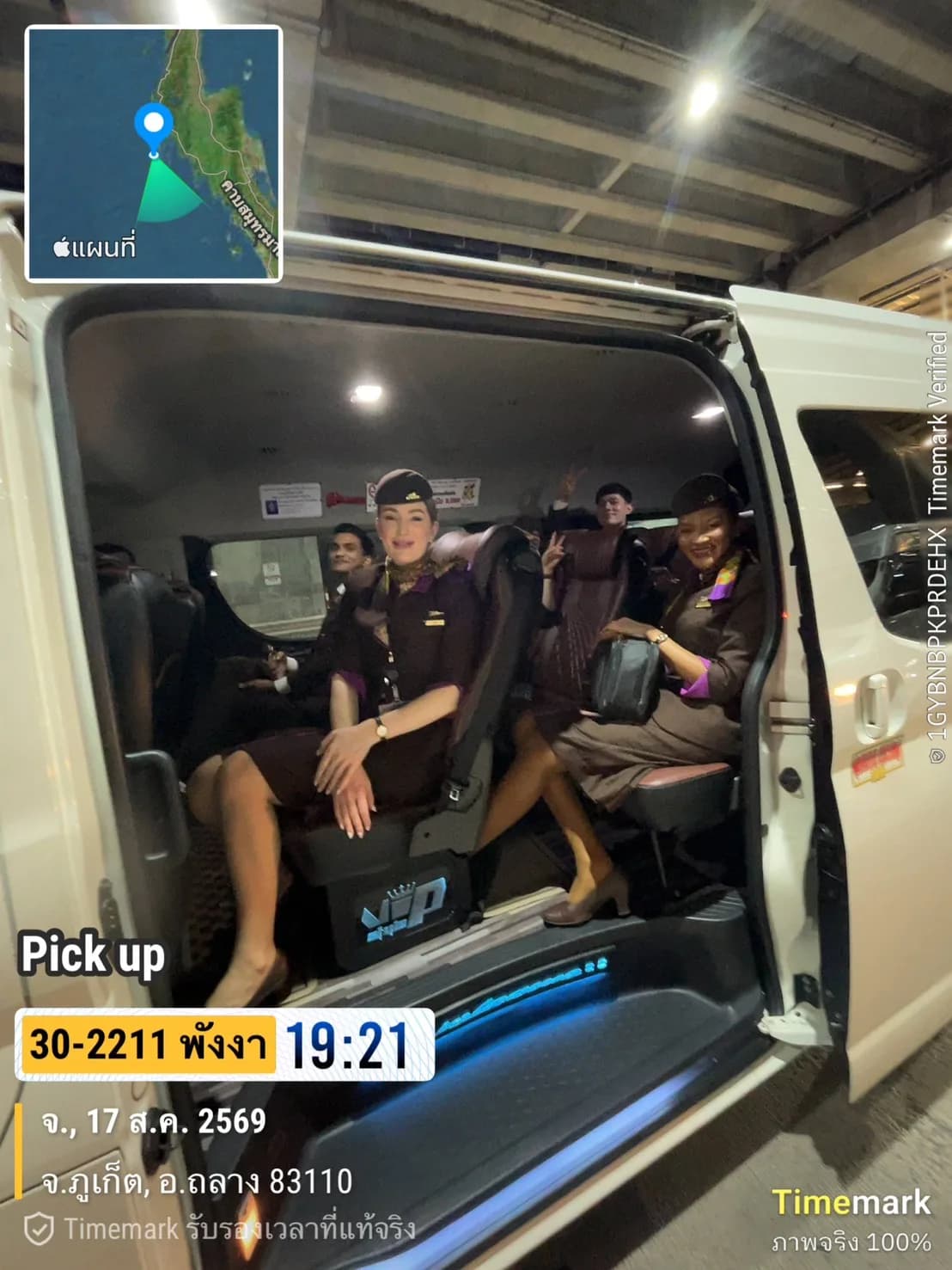 Airline cabin crew boarding a private van transfer at Phuket Airport in the evening