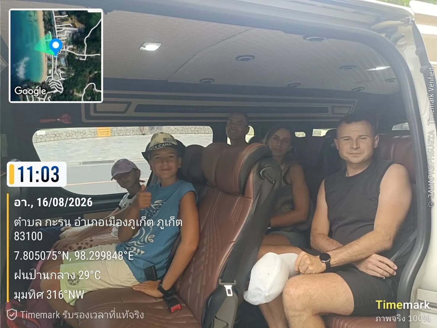 Family riding together in a private transfer van on the coast road towards Khao Lak