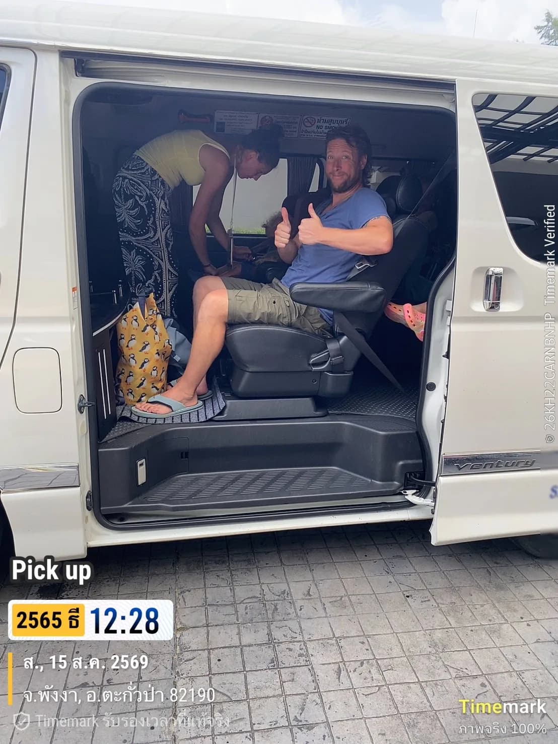 Guest giving a thumbs up from the transfer van during a pickup in Phang Nga