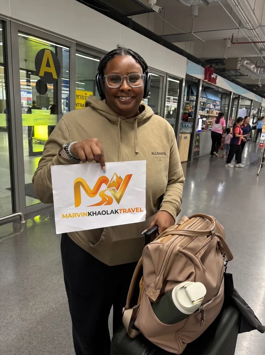 Guest welcomed in the Phuket Airport arrivals hall by her Khao Lak transfer driver