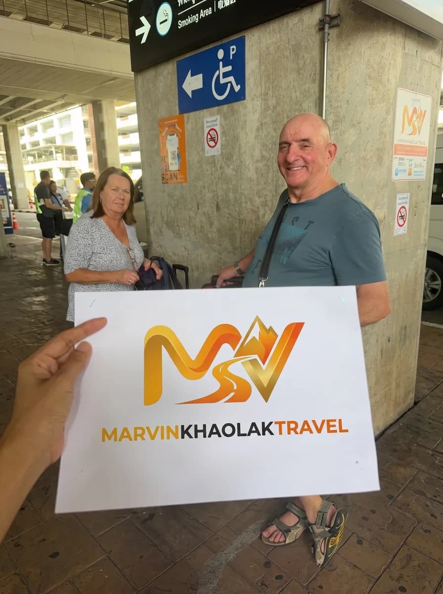 Couple met outside Phuket Airport for their hotel transfer to Khao Lak
